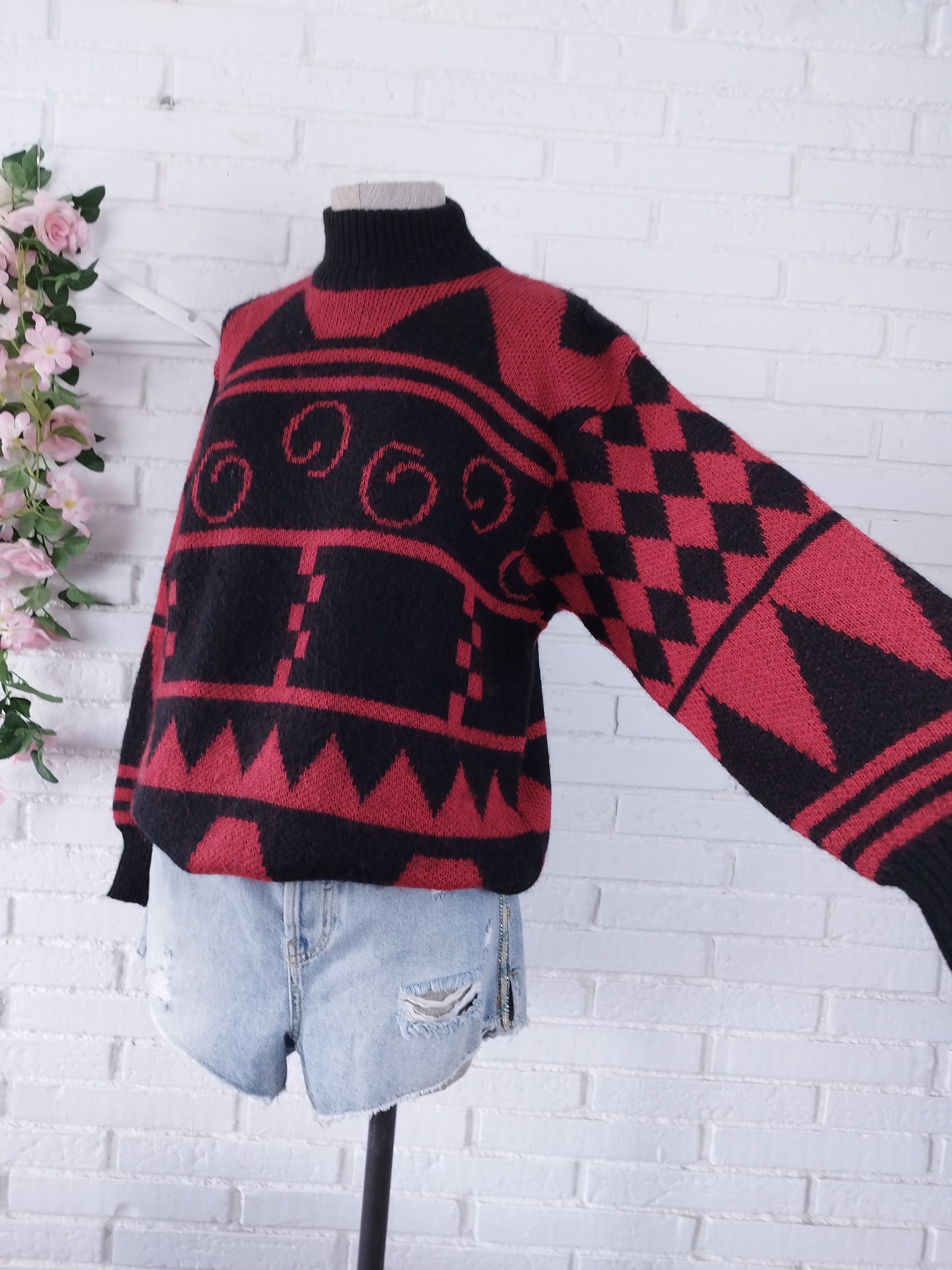 Vintage Wollstrickpullover aus den 90er-Jahren – Stehkragen, geometrisches Jacquardmuster und rot-schwarze Farbpalette